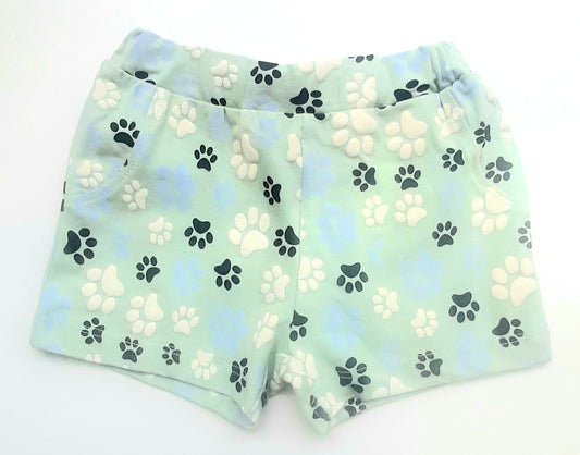 bermudas de bebé color verde menta con estampado en relieve de huellas de perrito por toda la prenda goma en la cinturilla y botones interiores para ajustar, algodon organico Name It