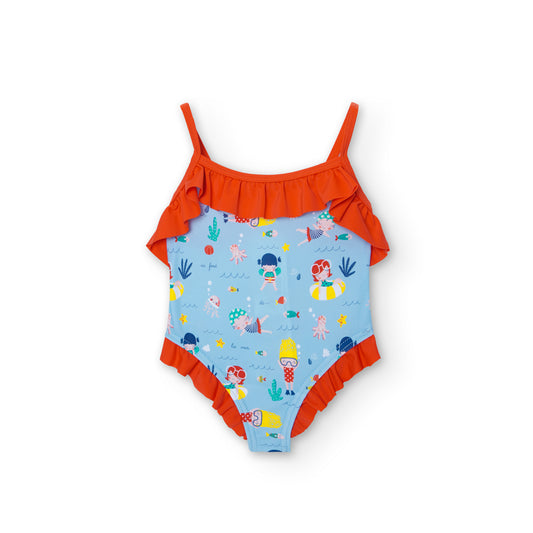 bañador de niña fondo azul claro con estampado de muñecas nadadoras, volante naranja en el pecho y en la entrepierna Boboli