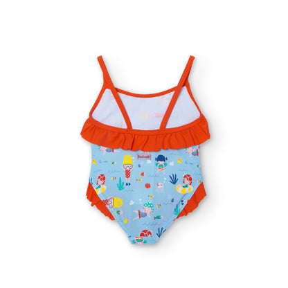 bañador de niña fondo azul claro con estampado de muñecas nadadoras, volante naranja en el pecho y en la entrepierna Boboli