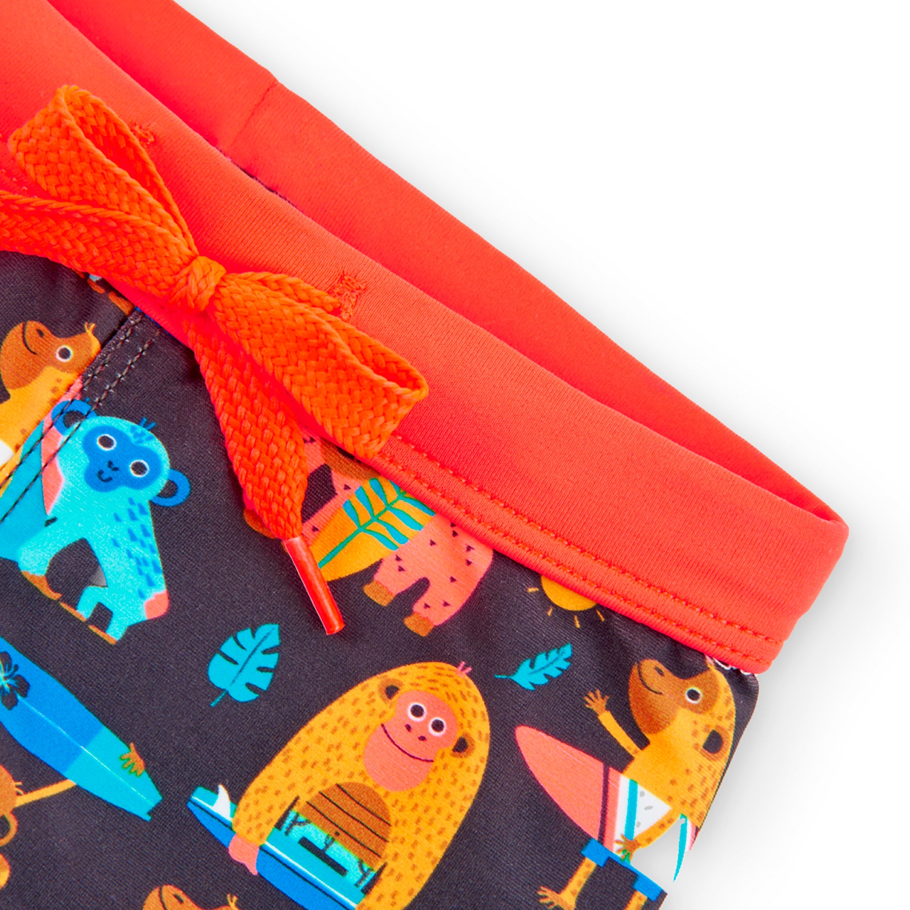 bañador niño tipo boxer con cordones estampado de monos en colores naranja azules y negro Boboli