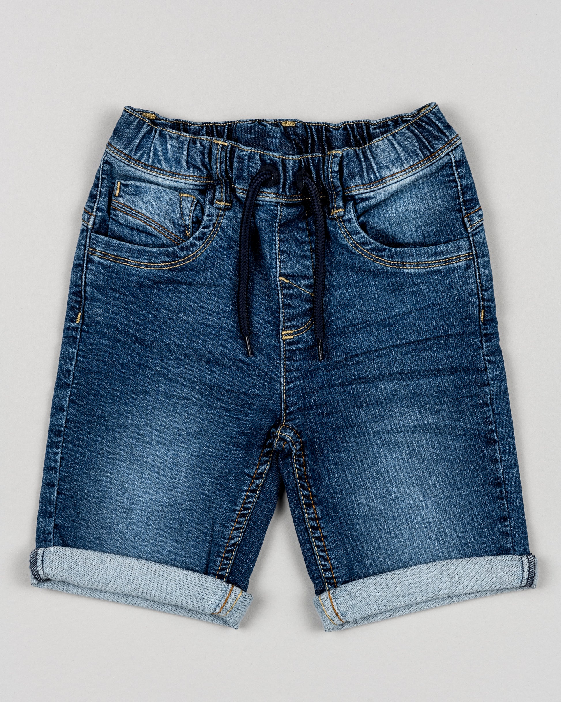 bermudas denim niño Losan con goma y botones interiores bolsillos delante y detras y dobladillo en el bajo Koskids