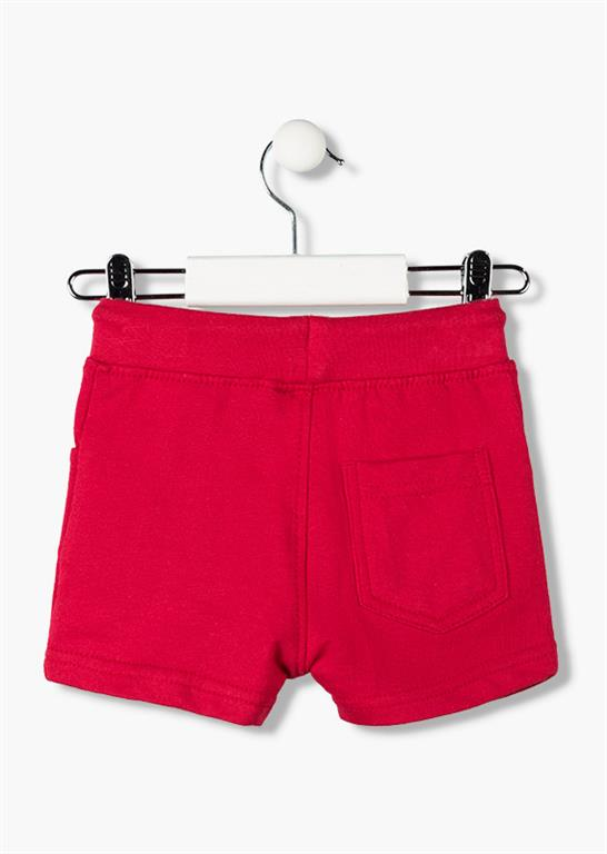 Bermudas tipo chandal de bebé con cinturilla ajustable con goma y cordones en color rojo con letras oscuras en la pierna Losan