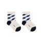 Pack de 3 pares de calcetines de niño en colores blanco con estampados de rombos y rayas Boboli